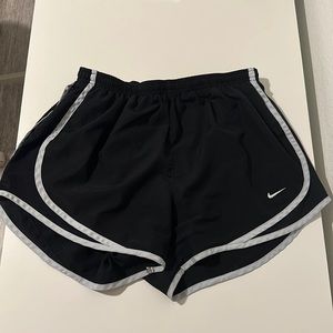 Black Nike running shorts